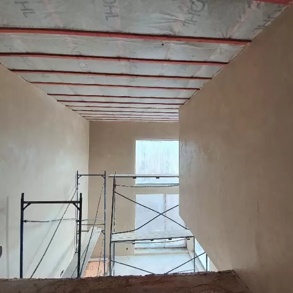 Штукатурка кирпичных стен в коттедже